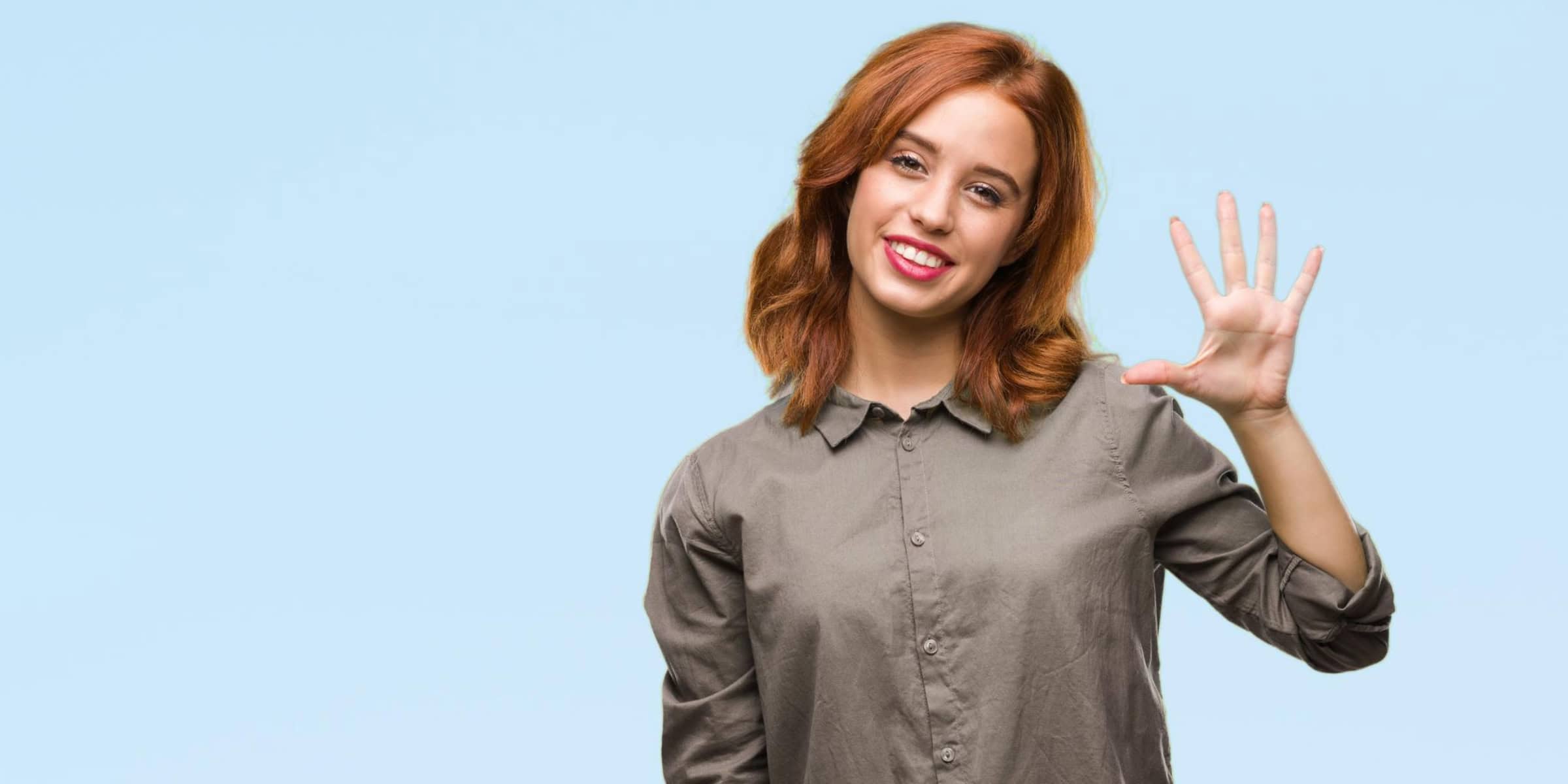 Woman holding up hand representing 5