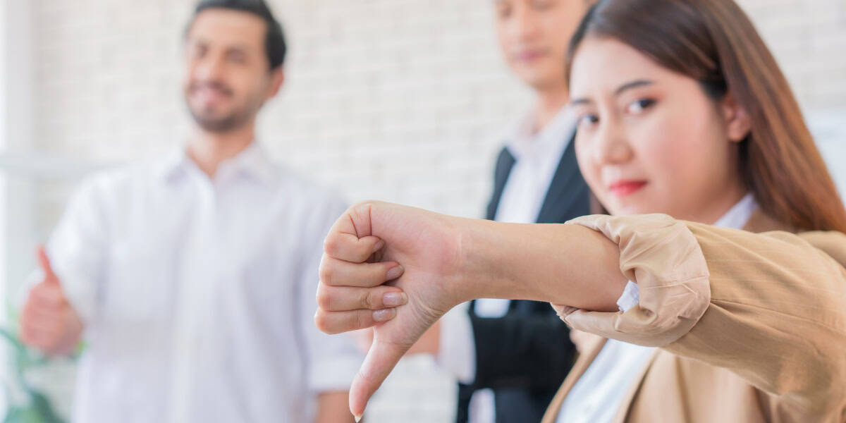 Woman with thumb down