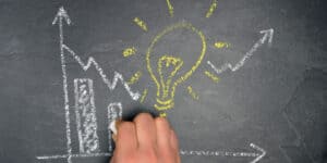business evaluation graph and lightbulb