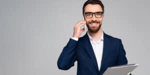 businessman on mobile holding a file