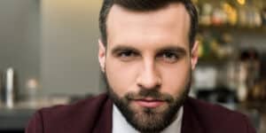 confident man looking into camera