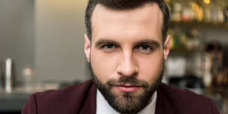 confident man looking into camera
