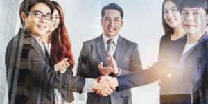 happy business employees handshake
