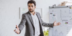 man presenting whiteboard