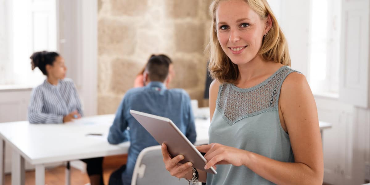 smiling woman with tablet