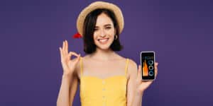 woman with a mobile showing graphs
