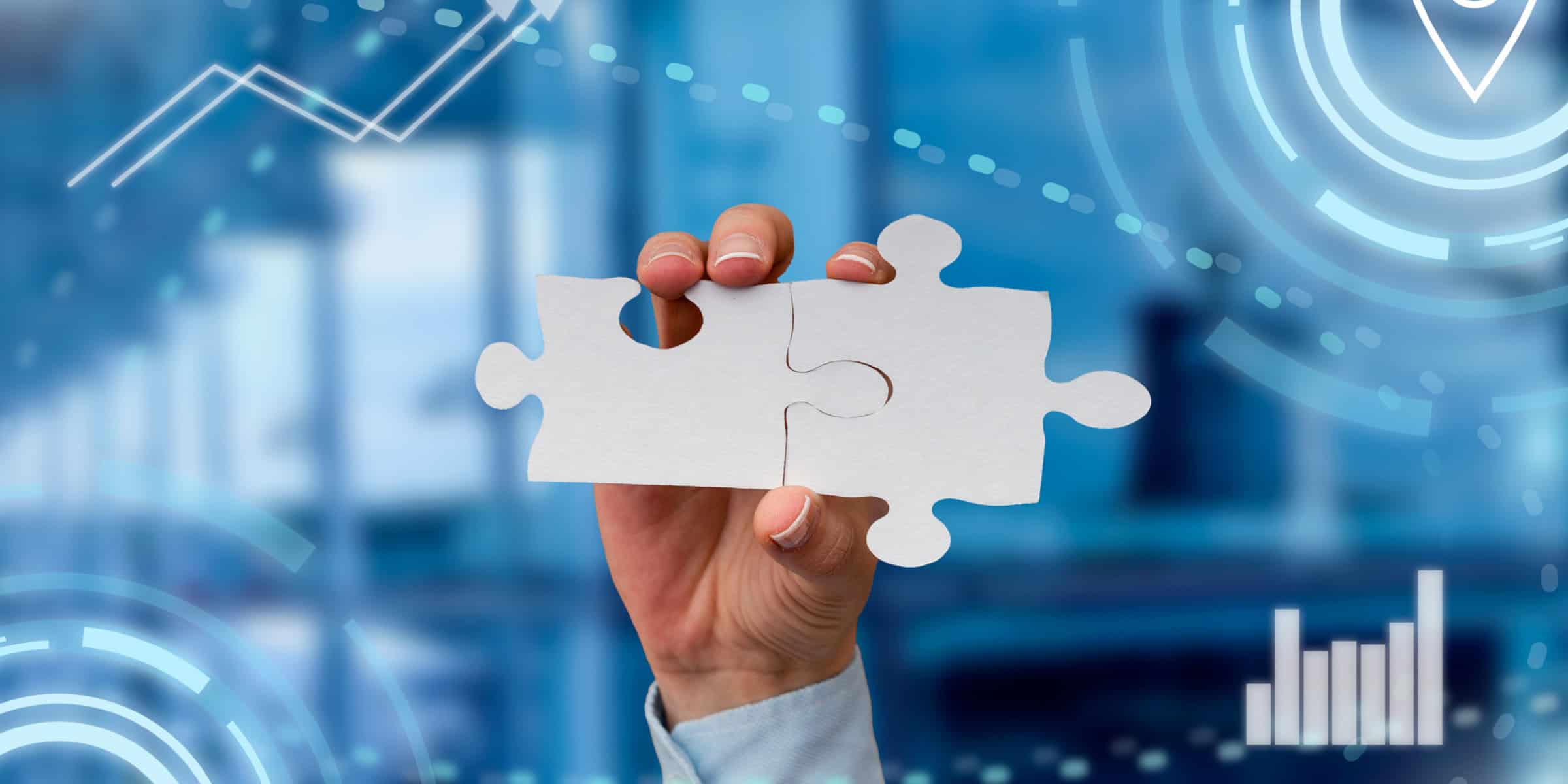 A person holding a piece of jigsaw puzzle.