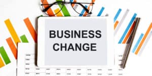 A tablet with the word business change on it.
