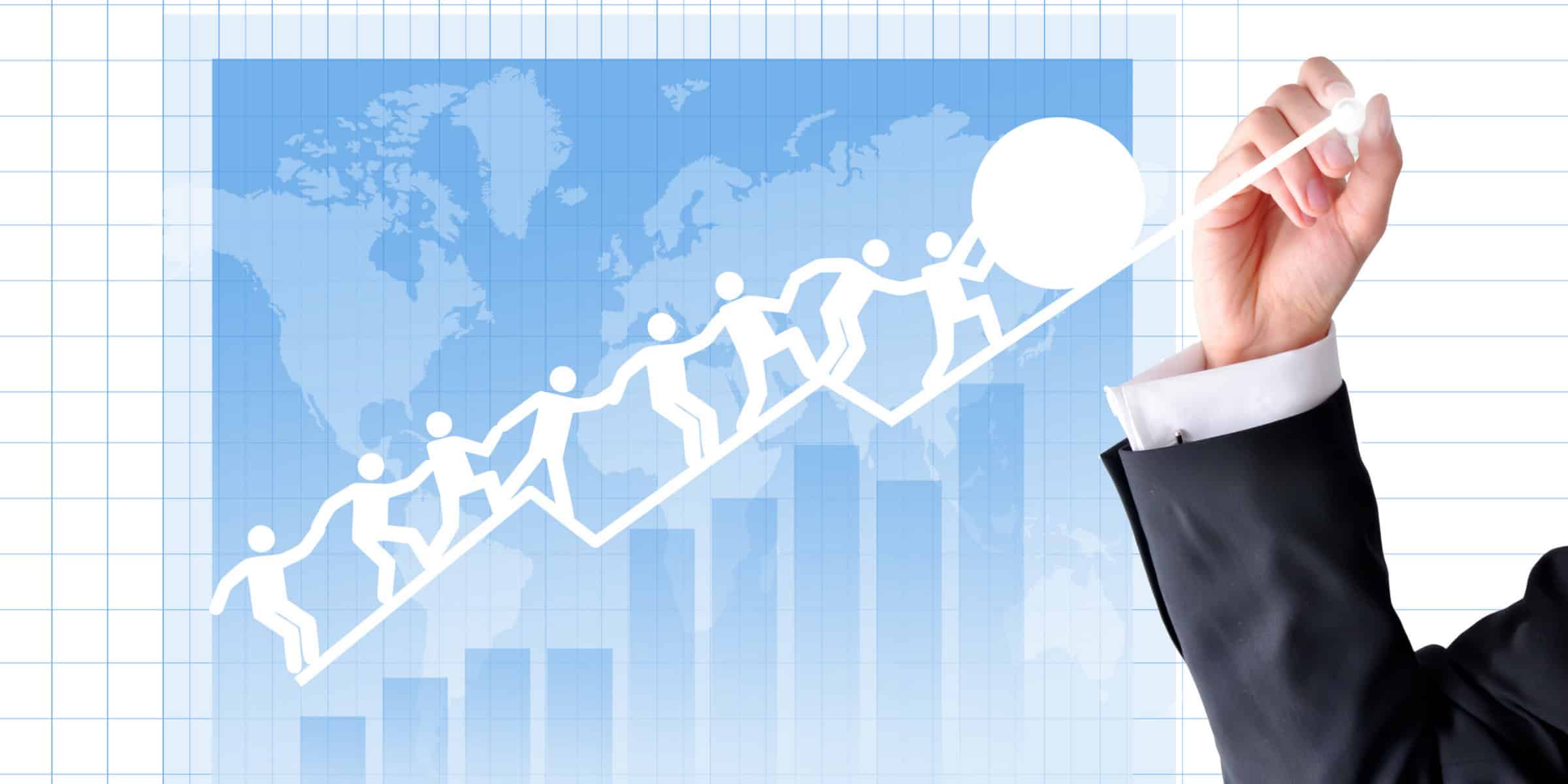 A businessman drawing a graph with people on it.