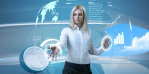 A woman is pointing at a computer screen.