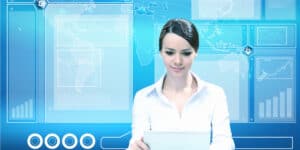 A woman is using a tablet computer in front of a blue background.