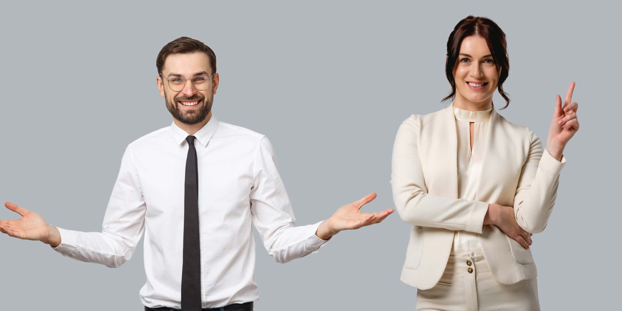 Two business people posing with their hands outstretched.