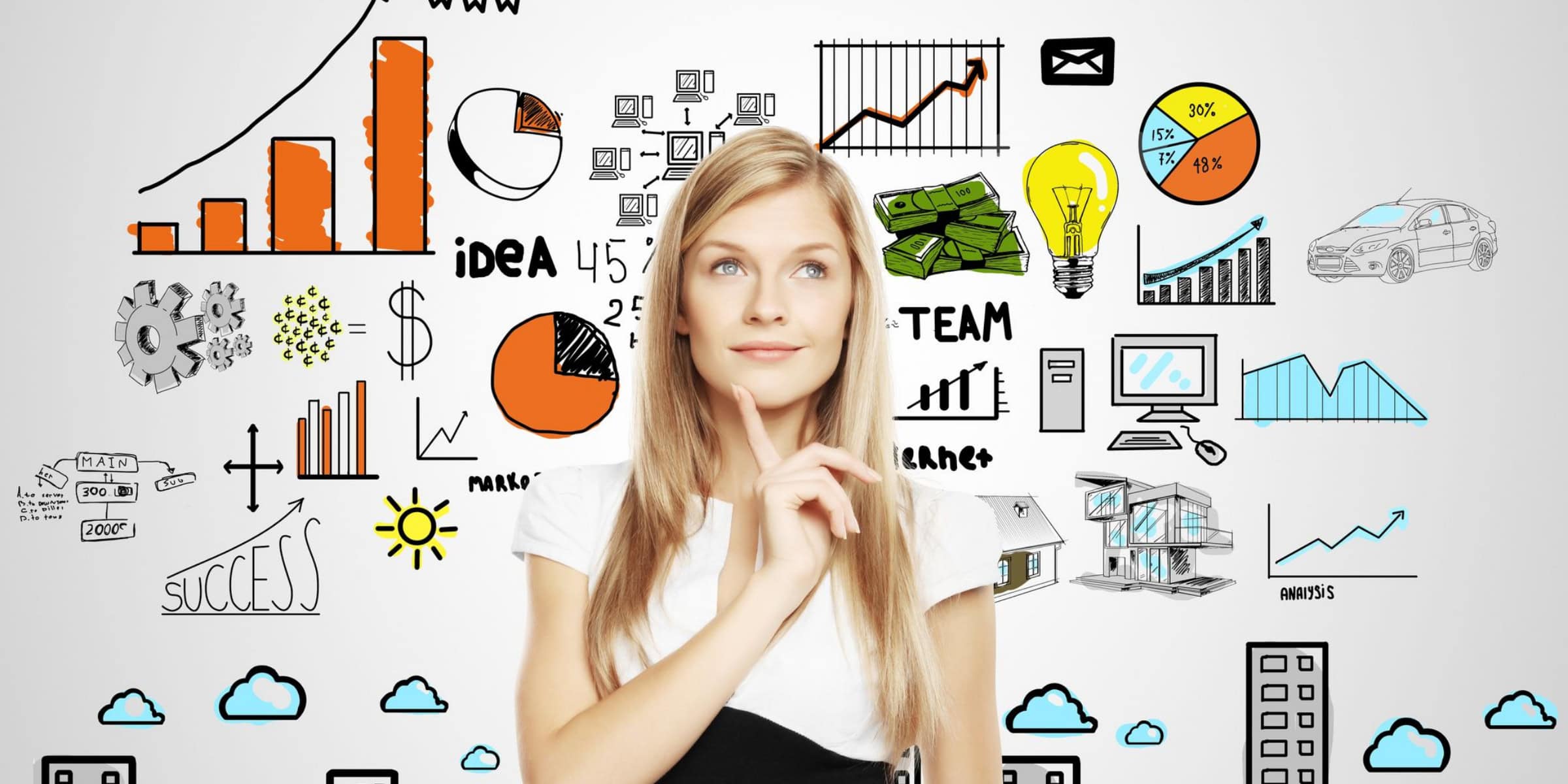 A woman is looking at a wall with business icons drawn on it.