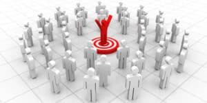 A person standing in the middle of a group of people.