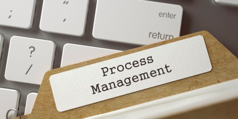 A paper clip with the word process management on it.