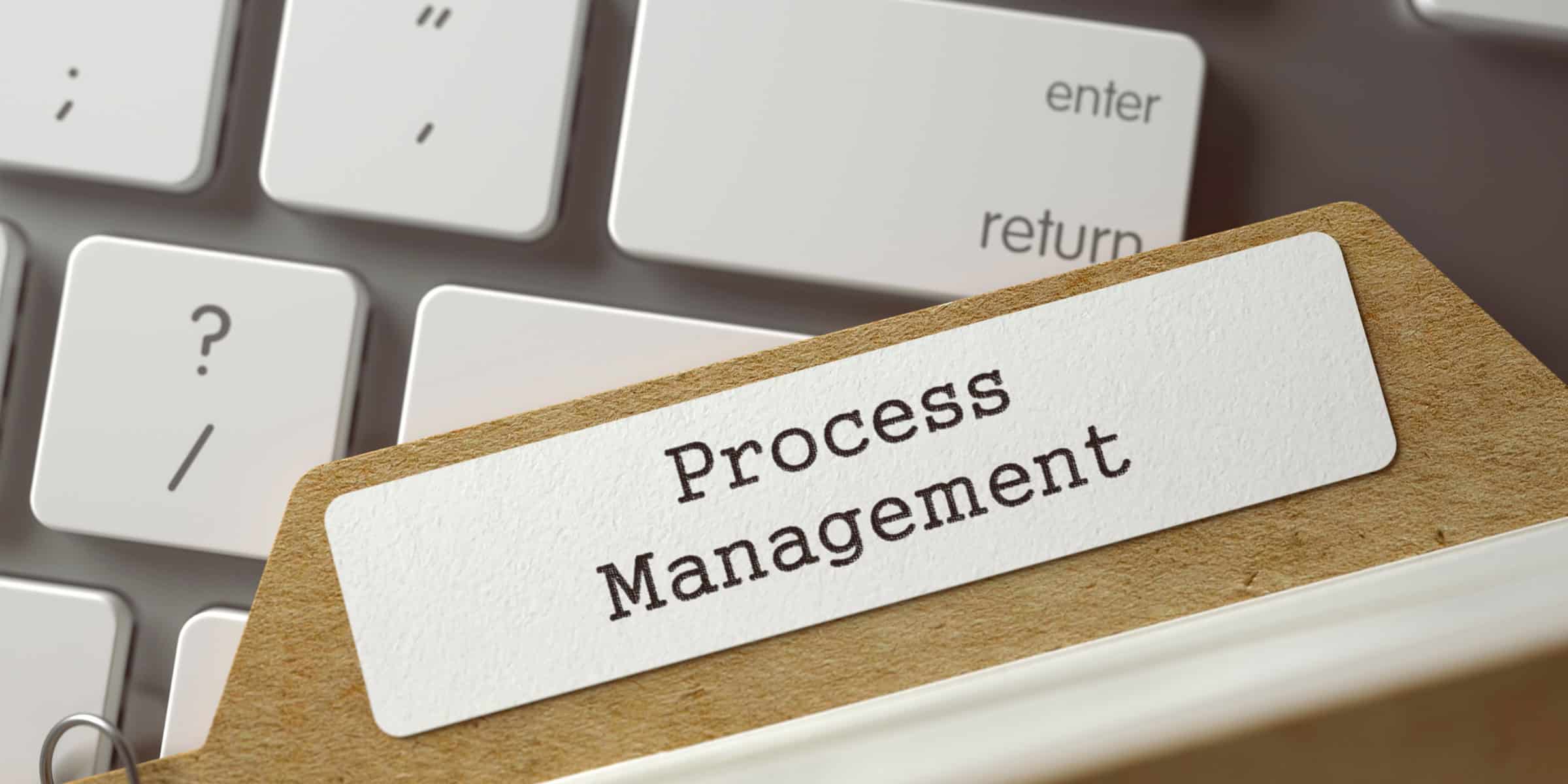 A paper clip with the word process management on it.