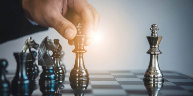 Two chess pieces on a chess board.