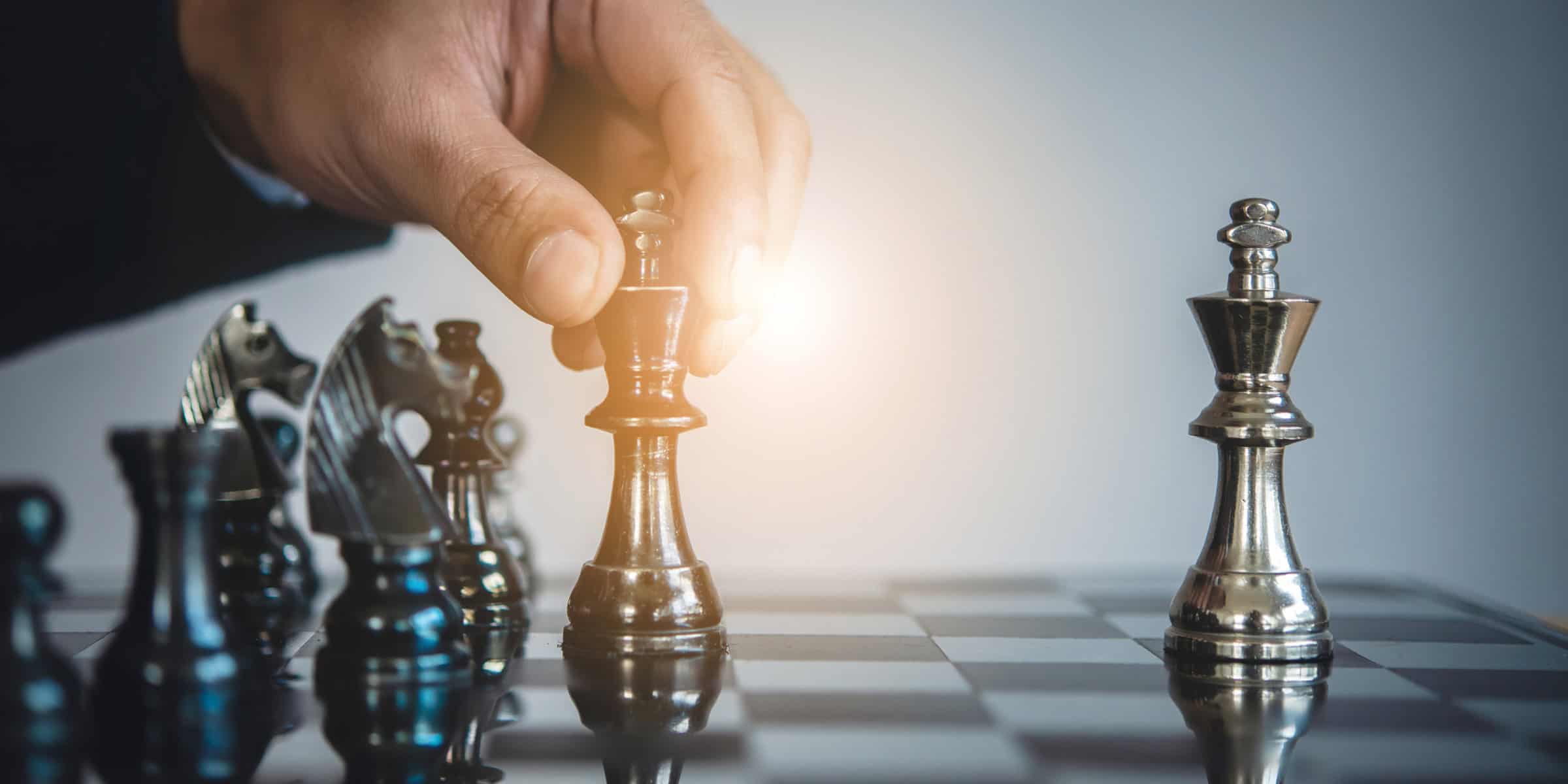 Two chess pieces on a chess board.
