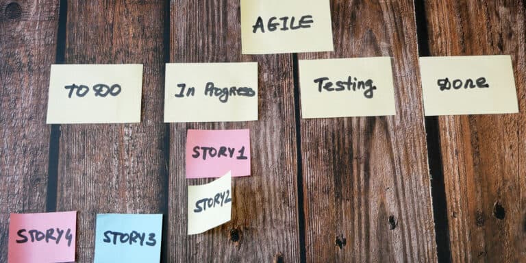 A group of sticky notes with the words agile on them.