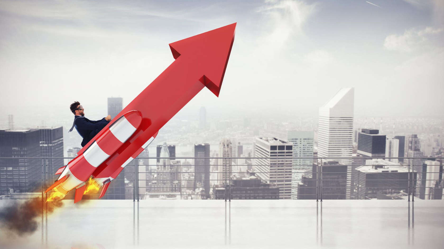 A businessman is flying up a red arrow with a city in the background.