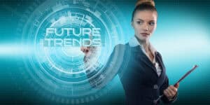 A business woman pointing at a futuristic screen with the word future trends.