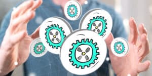 A man's hands with gears on them.