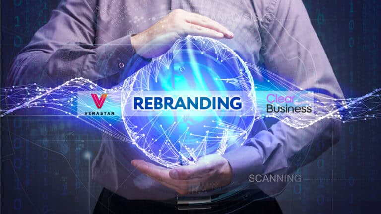 A man is holding up a rebranding logo.