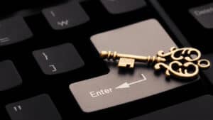 A golden key on a computer keyboard.