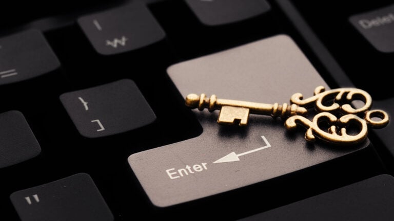 A golden key on a computer keyboard.