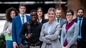 A group of business people posing for a photo.