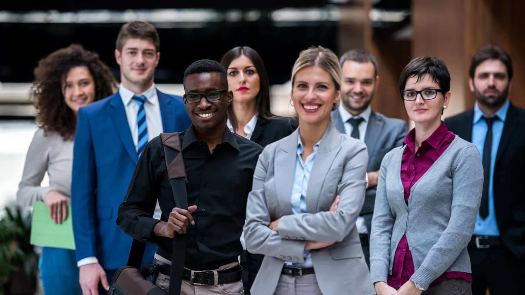 A group of business people posing for a photo.