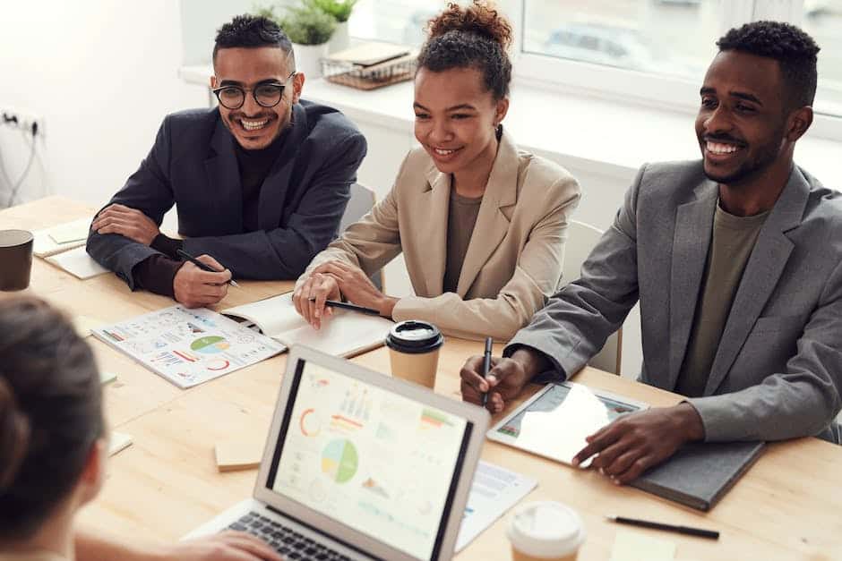 A group of people discussing and planning business process change management strategies in a modern office workspace.
