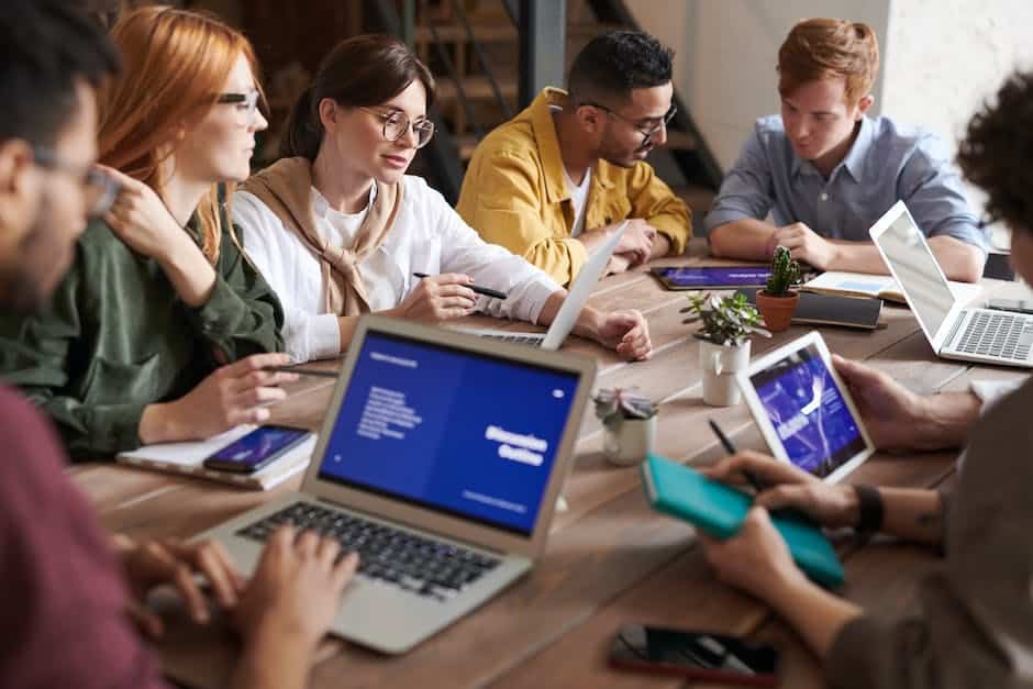 A group of professionals discussing change management in a conference room