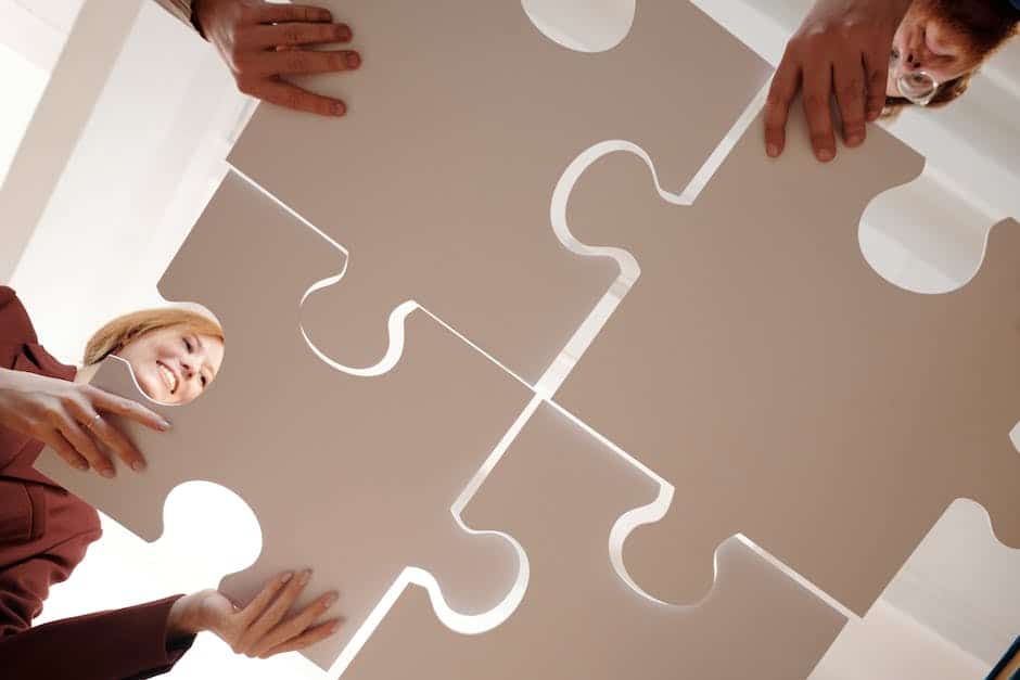 An image of a team working together to organize puzzle pieces, representing successful change management performance.