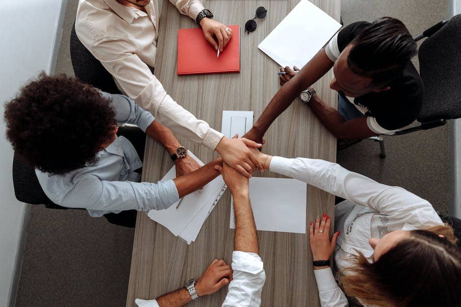 A group of diverse professionals collaborating in a modern office setting.