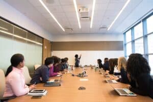 A group of people sitting around a conference table.