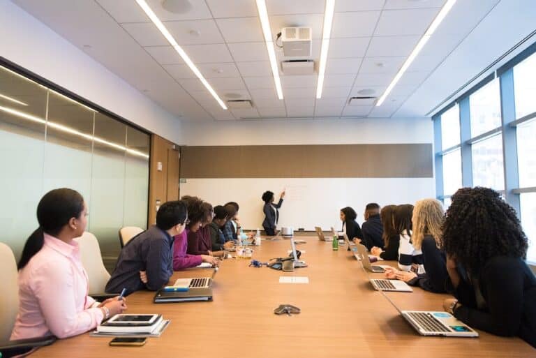 A group of people sitting around a conference table.